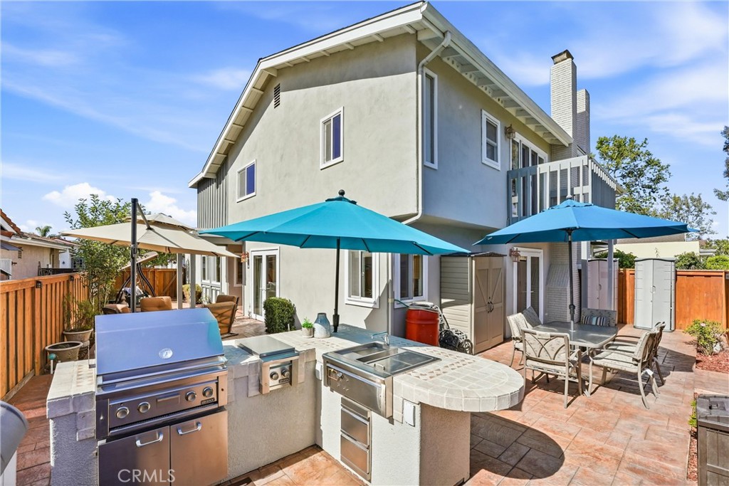 Built-in barbecue island in the private backyard at 8322 Padrino