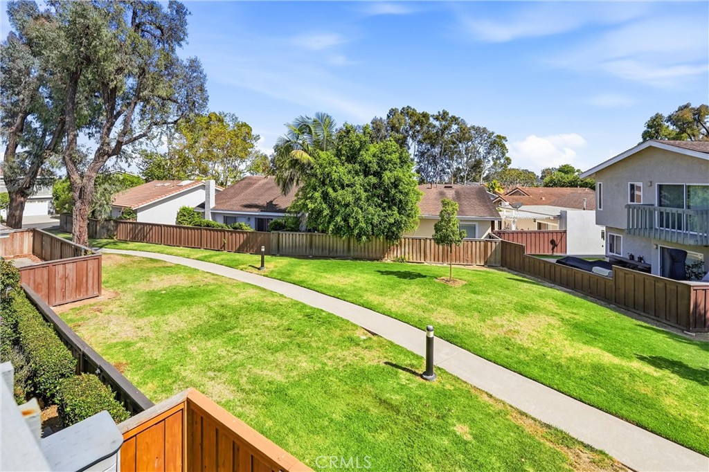 Greenbelt behind 8322 Padrino with mature trees and open lawn
